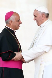 VATICAN CITY, VATICAN - MAY 18: Pope Francis greets Archbishop Rino Fisichella, president of the Pontifical Council for Promoting New Evangelisation, during the celebration of Pentecost Vigil with lay Ecclesial movements in St. Peter's Square on May 18, 2013 in Vatican City, Vatican. This weekend tens of thousands of people descend on the Vatican to celebrate the Pentecost Vigil together with Pope Francis. Echoing similar celebrations that took place with his predecessors Blessed John Paul II and Benedict XVI, the Holy Father has called the New Movements and Ecclesial Communities to invoke the Holy Spirit upon them and their continued mission in the life of the Church. (Photo by Franco Origlia/Getty Images)