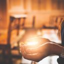 A beautiful Asian woman is praying to God with His blessing for a better life in a Christian church in Chanthaburi province. The concept of forgiveness and belief in goodness.